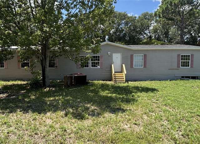Property at 151 West Loop, Oak Hill, FL 32759, 4 beds, 2 baths