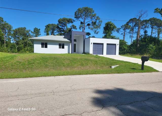 Property at 521 Frank Jewett Ave S, Lehigh Acres, FL 33974, 4 beds, 2.5 baths