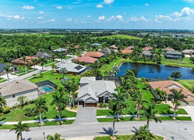 Property at 303 Cockle Shell Loop, Apollo Beach, FL 33572, 4 beds, 4 baths