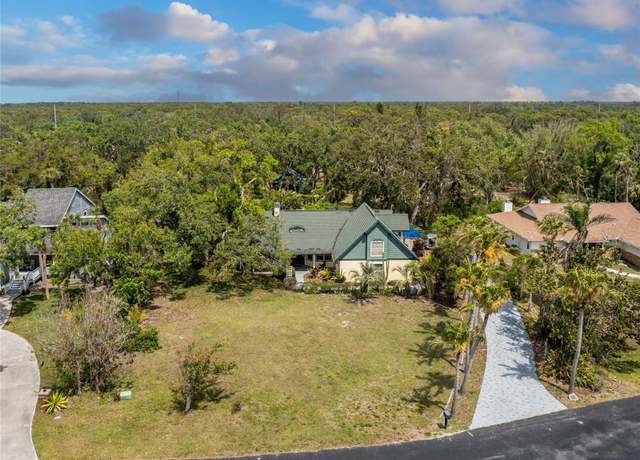 Property at 1828 Whispering Pines Cir, Englewood, FL 34223, 4 beds, 2.5 baths