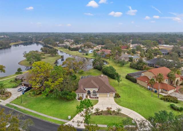 Property at 4412 Lake IN The Woods Dr, Spring Hill, FL 34607, 4 beds, 3.5 baths