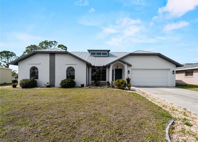 Property at 908 Tropical Cir NW, Port Charlotte, FL 33948, 4 beds, 2.5 baths
