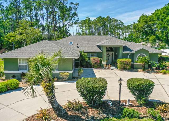 Property at 33 Poinsettia Ln, Palm Coast, FL 32164, 3 beds, 2.5 baths