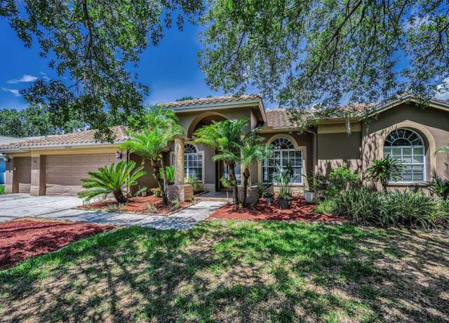 Property at 1516 E Lake Woodlands Pkwy, Oldsmar, FL 34677, 4 beds, 3 baths