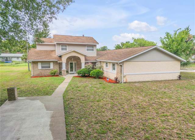 Property at 299 W Hickory Ave, Oak Hill, FL 32759, 4 beds, 3 baths