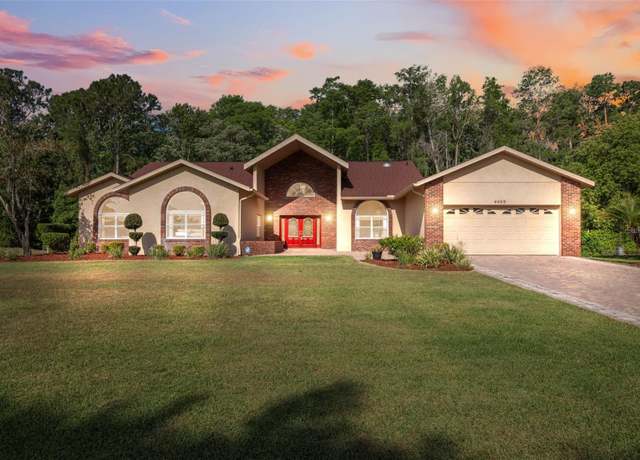 Property at 4469 Lake IN The Woods Dr, Spring Hill, FL 34607, 4 beds, 3 baths