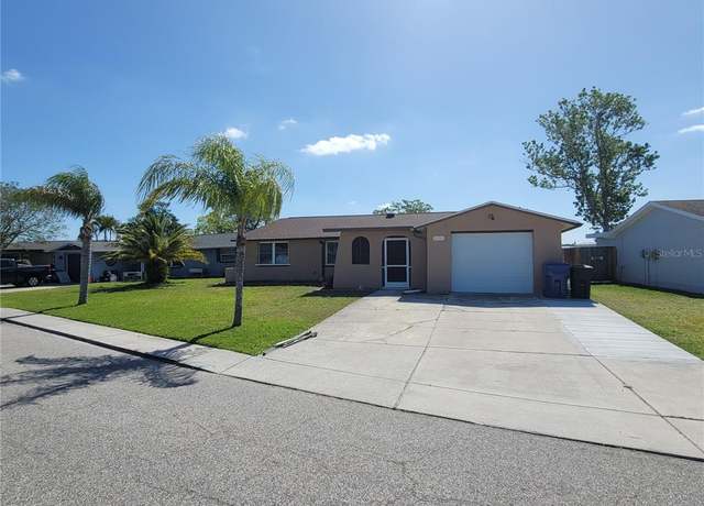 Property at 2110 Society Dr, Holiday, FL 34691, 4 beds, 2 baths