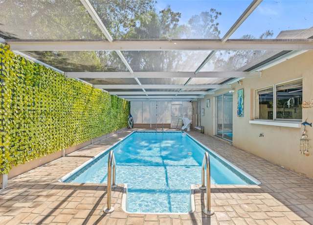 Property at 12222 Meadowbrook Ln, Hudson, FL 34667, 4 beds, 3 baths