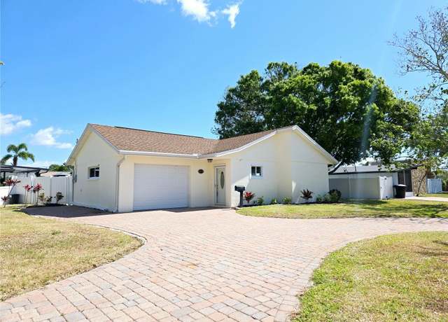 Property at 8719 Sunlit Cove Dr NE, St Petersburg, FL 33702, 3 beds, 2 baths