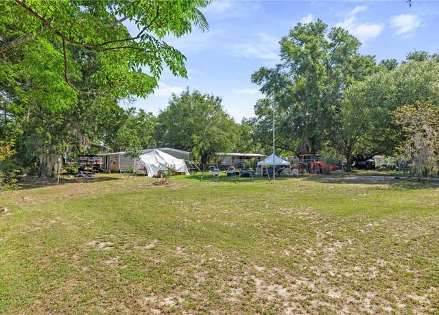 Property at 406 Mystery House Rd, Davenport, FL 33837, 4 beds, 2 baths