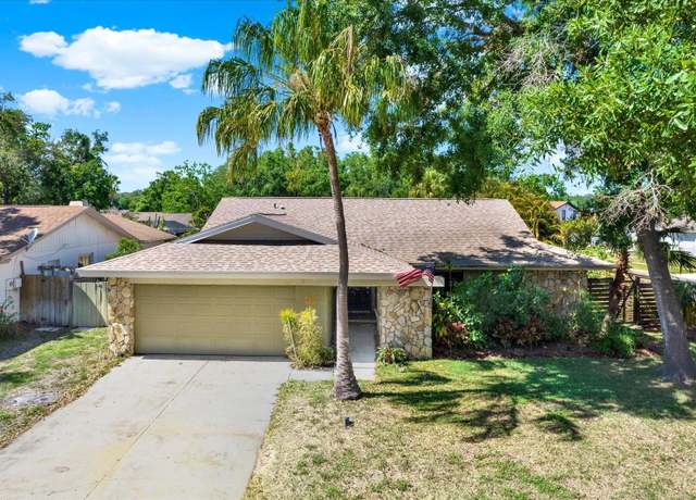 Property at 4101 Hollowtrail Dr, Tampa, FL 33624, 4 beds, 2 baths