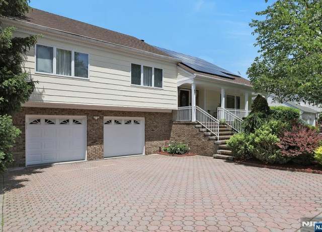 Property at 420 Golf Course Dr, Leonia, NJ 07605, 4 beds, 3 baths