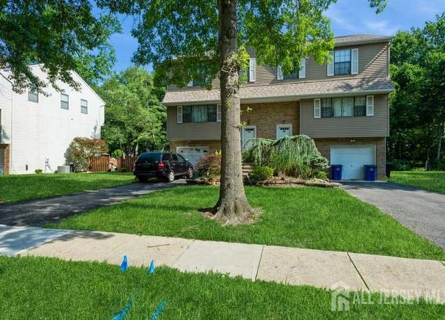 Property at 56 Dortmunder Dr, Manalapan, NJ 07726, 4 beds, 2.5 baths