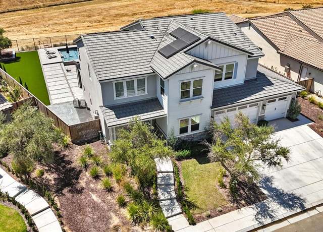 Property at 1048 Sawtooth Way S, Madera, CA 93636, 5 beds, 4 baths