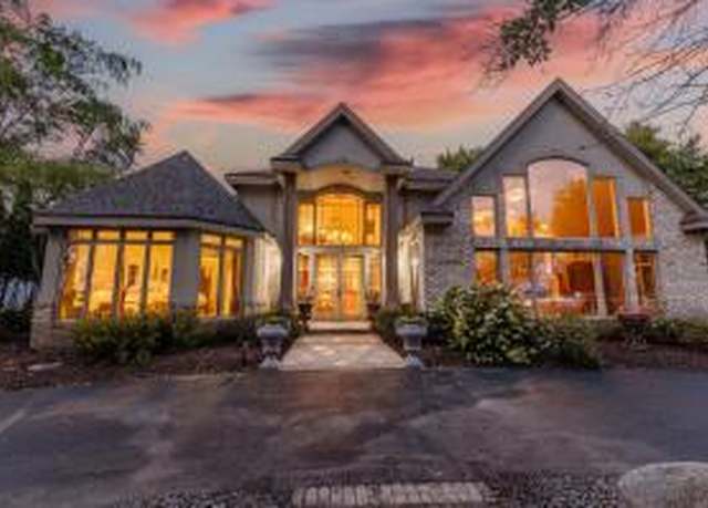 Property at 302 Lac La Belle Dr, Oconomowoc, WI 53066, 4 beds, 3.5 baths