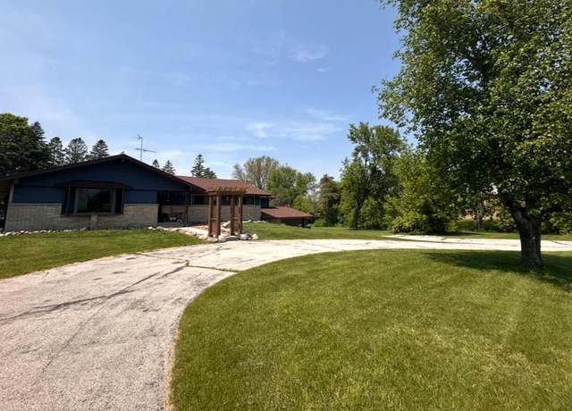 Property at 1420 Woodland Rd, Kohler, WI 53044, 6 beds, 3.5 baths
