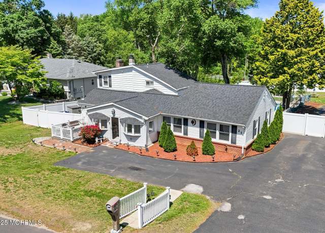 Property at 21 Wickatunk Rd, Manalapan, NJ 07726, 5 beds, 3.5 baths