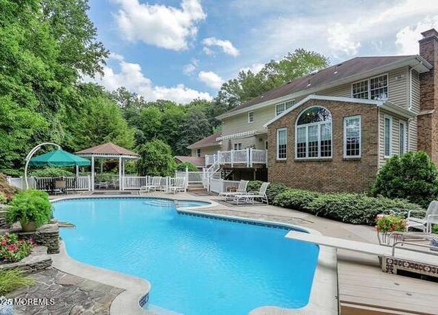 Property at 65 Devonshire Dr, Morganville, NJ 07751, 5 beds, 4 baths