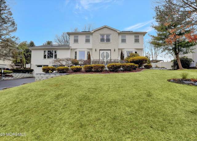 Property at 23 Country Oaks Dr, Manalapan, NJ 07726, 5 beds, 3.5 baths