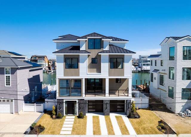 Property at 407 N Pembroke Ave, Margate, NJ 08402, 5 beds, 5.5 baths