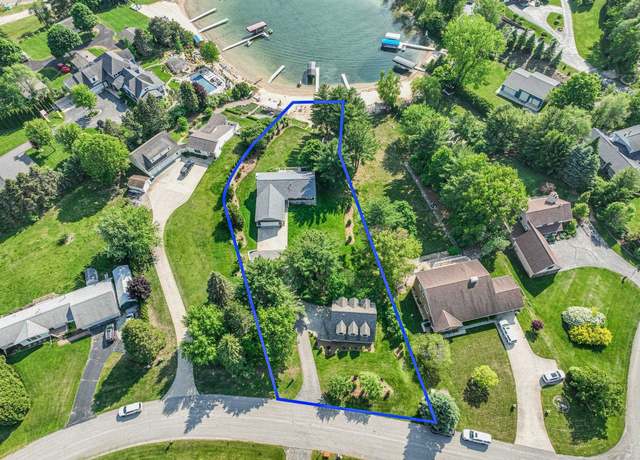 Property at 5163 Silver Cove Dr, Garfield Charter Township, MI 49685, 5 beds, 3 baths