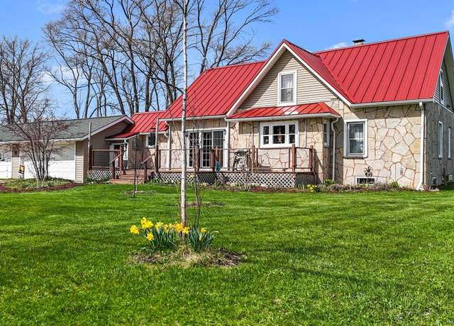 Property at 4652 Cairn Hwy, Kewadin, MI 49648, 4 beds, 3 baths