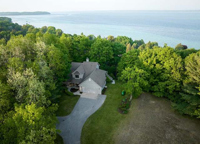 Property at 16756 Whispering Pnes, Traverse City, MI 49686, 5 beds, 3.5 baths