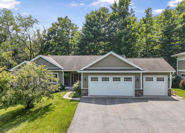Property at 876 Incochee Woods Dr, Garfield Charter Township, MI 49684, 4 beds, 3 baths