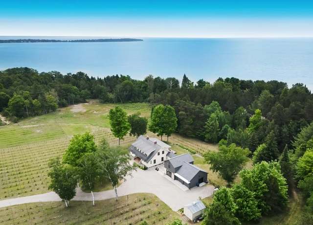 Property at 12202 E Woolsey Lake Rd, Northport, MI 49670, 4 beds, 3 baths