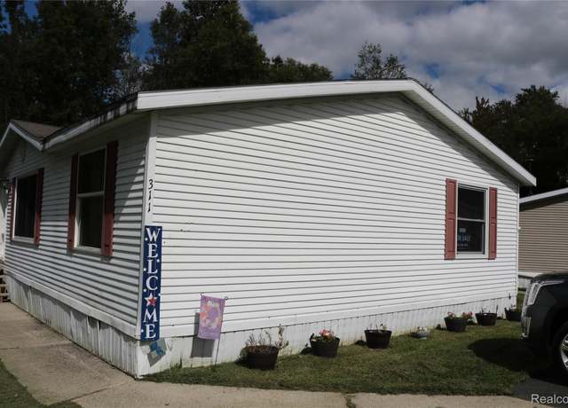 Property at 311 Peach Blossom Ct, Otisville Village, MI 48463, 4 beds, 3 baths