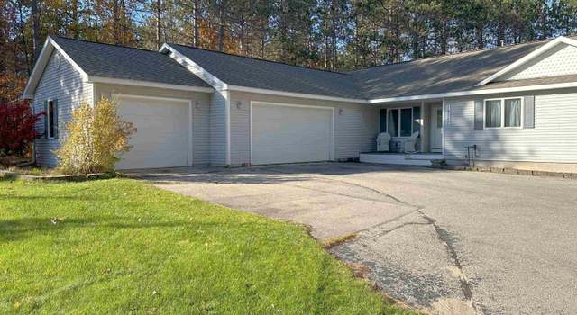 Photo of 19550 Pine Woods Dr, Almira Twp, MI 49650