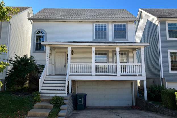 house built into hill for sale