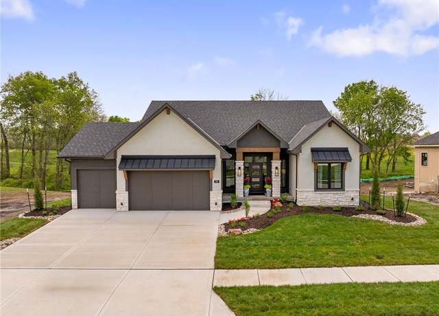 Property at 701 Hampstead Dr, Raymore, MO 64083, 4 beds, 3 baths