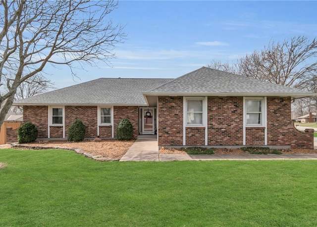 Property at 100 S Woodson Dr, Raymore, MO 64083, 3 beds, 2.5 baths