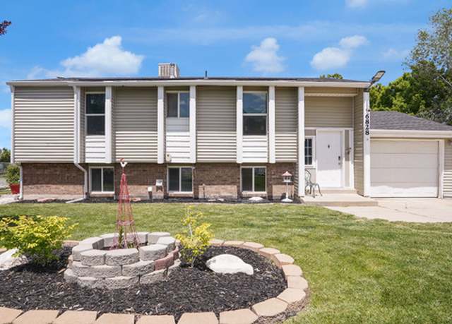 Property at 6828 W Copperhill Dr, West Valley City, UT 84128, 4 beds, 2 baths