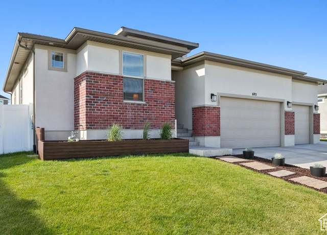 Property at 693 W Fireside Ln, Stansbury Park, UT 84074, 5 beds, 3 baths