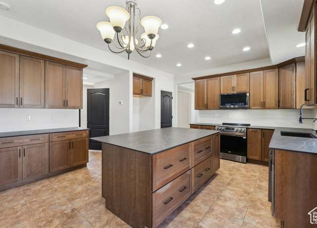 Property at 6169 N Schooner Ln W, Stansbury Park, UT 84074, 6 beds, 3.5 baths
