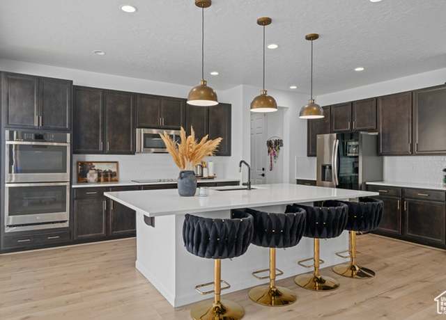 Property at 8586 N Tiffany Ln E, Lake Point, UT 84074, 4 beds, 3 baths