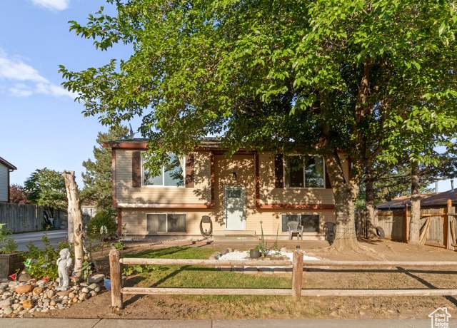 Property at 6097 S Trowbridge W, Salt Lake City, UT 84118, 5 beds, 2 baths