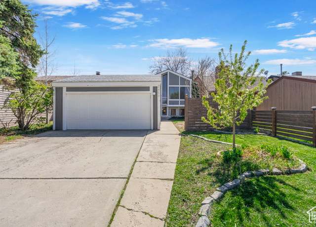 Property at 2459 W Dutch Draw Dr, Taylorsville, UT 84129, 4 beds, 2 baths