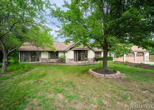 Property at 5855 Grand River Dr NE, Ada, MI 49301, 5 beds, 4 baths