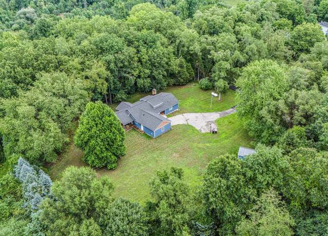 Property at 8300 Grand River Dr SE, Ada, MI 49301, 4 beds, 4 baths