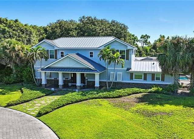 Property at 438 Gordonia Rd, Naples, FL 34108, 4 beds, 5.5 baths