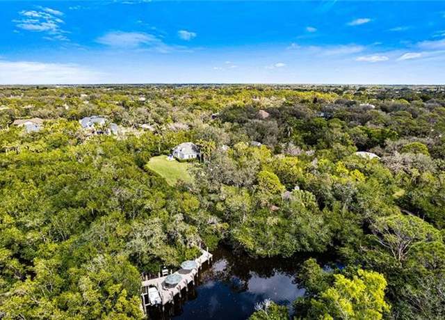 Property at 216 Cocohatchee Blvd, Naples, FL 34110, 4 beds, 5 baths