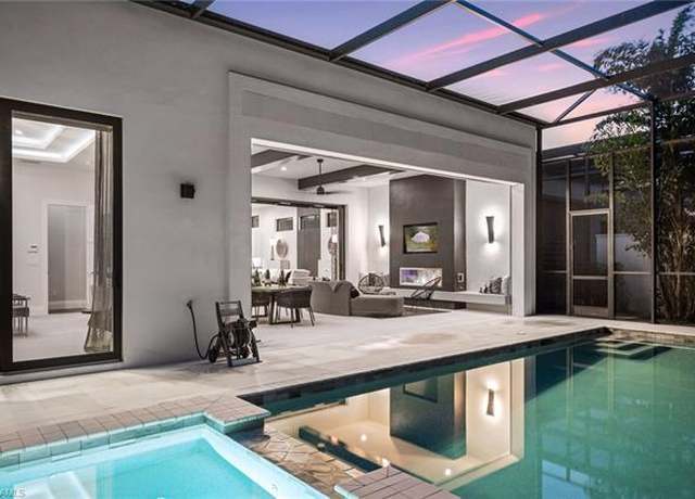 Property at 10411 Trevi Isle Way, Miromar Lakes, FL 33913, 4 beds, 4.5 baths