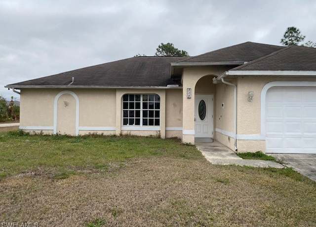 Property at 505 Penton Ave S, Lehigh Acres, FL 33974, 4 beds, 2 baths