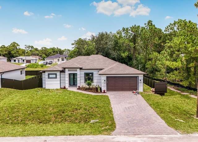 Property at 3204 29th St SW, Lehigh Acres, FL 33976, 4 beds, 3 baths