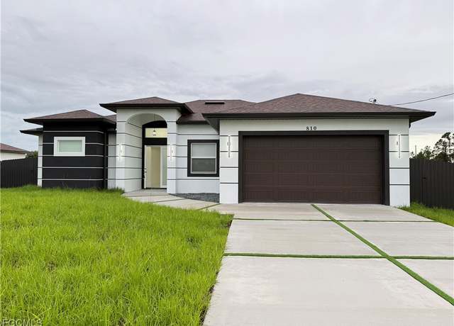 Property at 810 Jaguar Blvd, Lehigh Acres, FL 33974, 4 beds, 2 baths