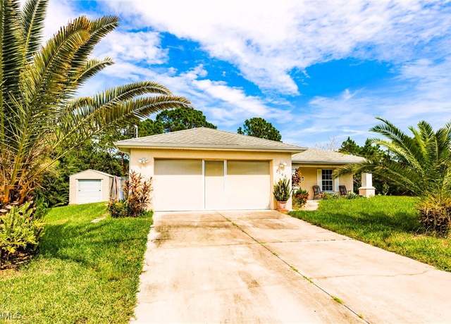 Property at 2100 W 16th St, Lehigh Acres, FL 33972, 3 beds, 2 baths