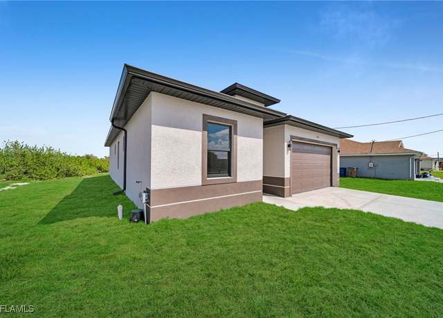 Property at 409 Grant Blvd, Lehigh Acres, FL 33974, 3 beds, 2 baths